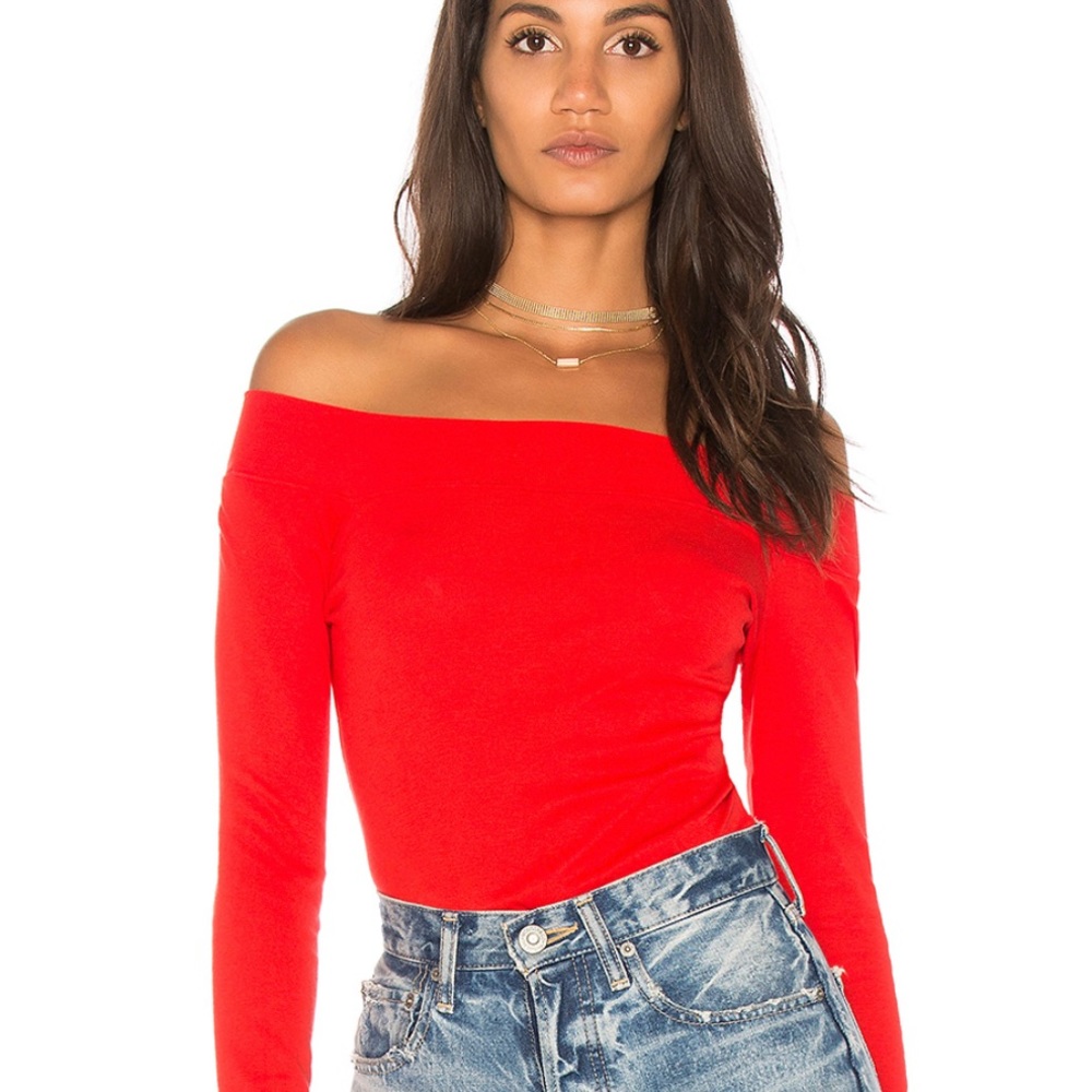 Red, off the shoulder, thong bodysuit. “The room”